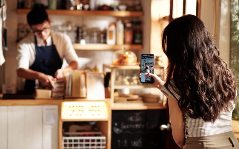 woman-filming-coffeeshop-worker-2022-09-29-21-14-52-utc.jpg